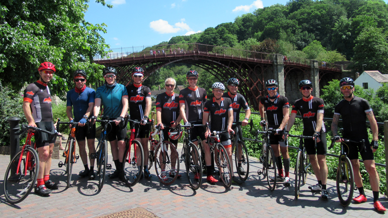 group of cyclists in front of the Ironbridge