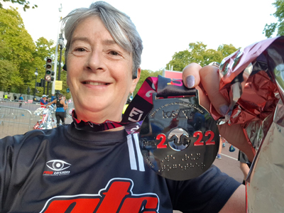 Karen Dennett holding London marathon medal