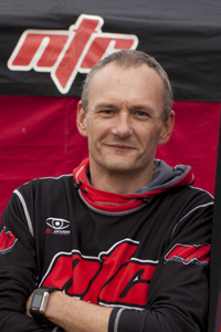 a man wearing a black and red top