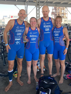 four triathletes in blue GB suits