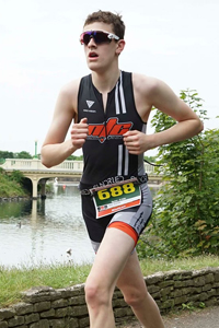 A teenage boy running in a race