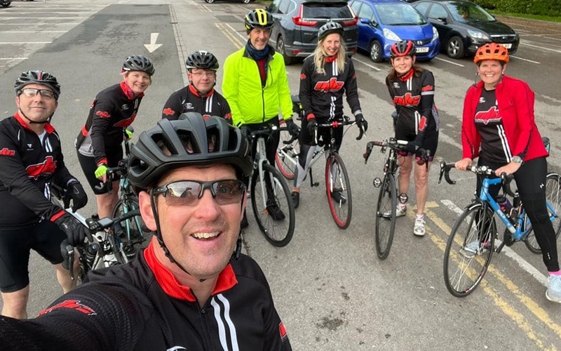 group of cyclists in car park ready to set off